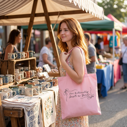 Young lady browsing a weekend market with the pink tote